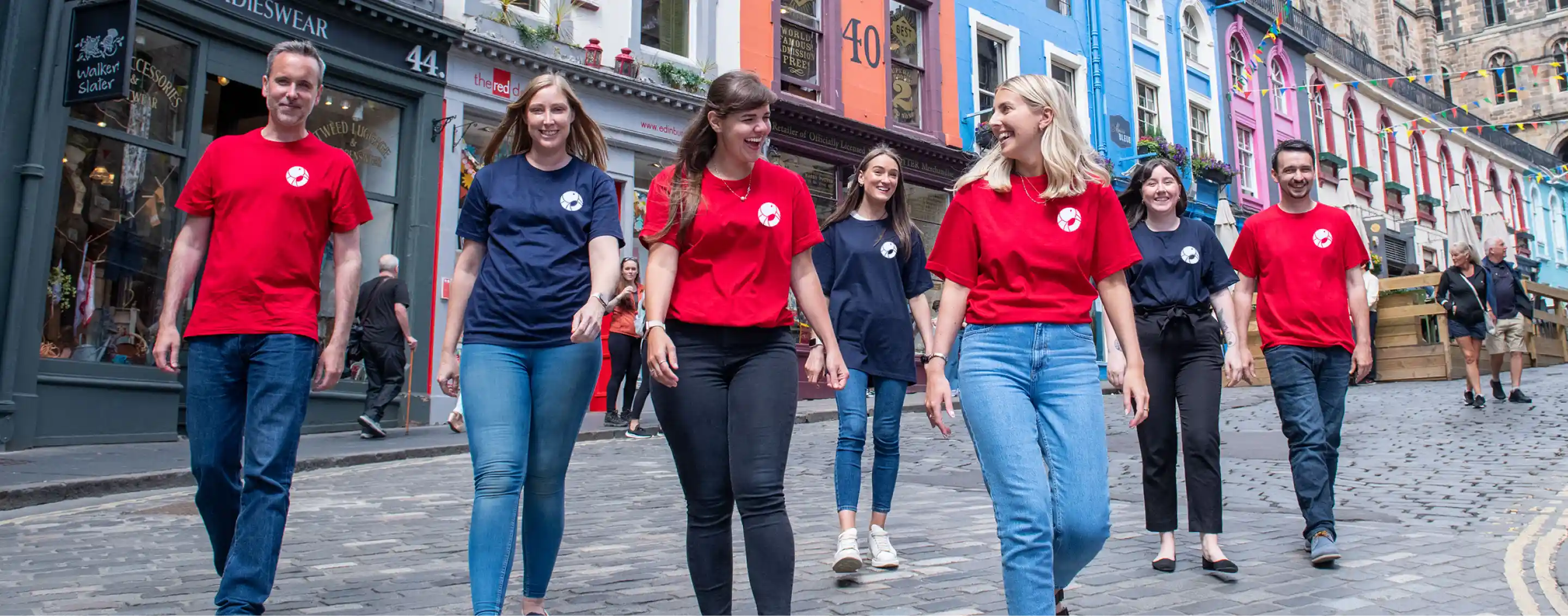 A group of people walking in the street